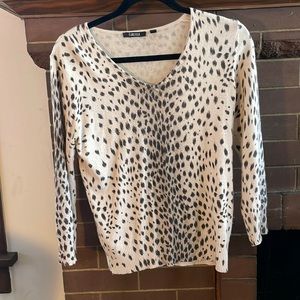 CARLISLE cheetah print sweater with three-quarter length sleeves.
